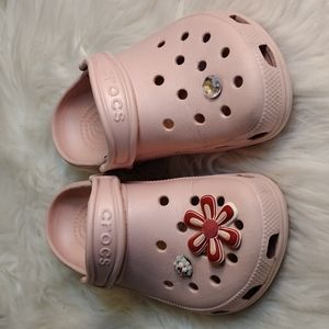 Crocs pink says sz M 1 W 3 will fit a child.